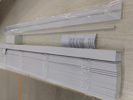 packages of faux wood blinds